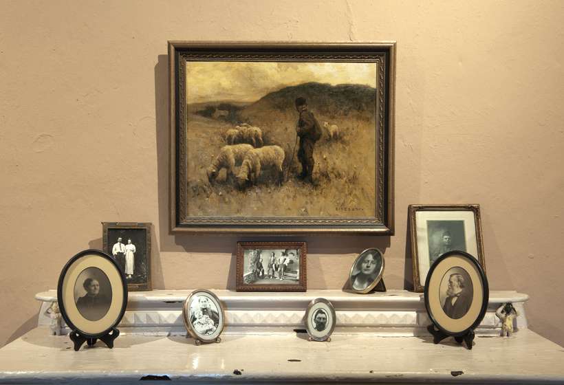Mantel in the office shows one of Couse’s paintings and photographs of the generations of the Couse family.