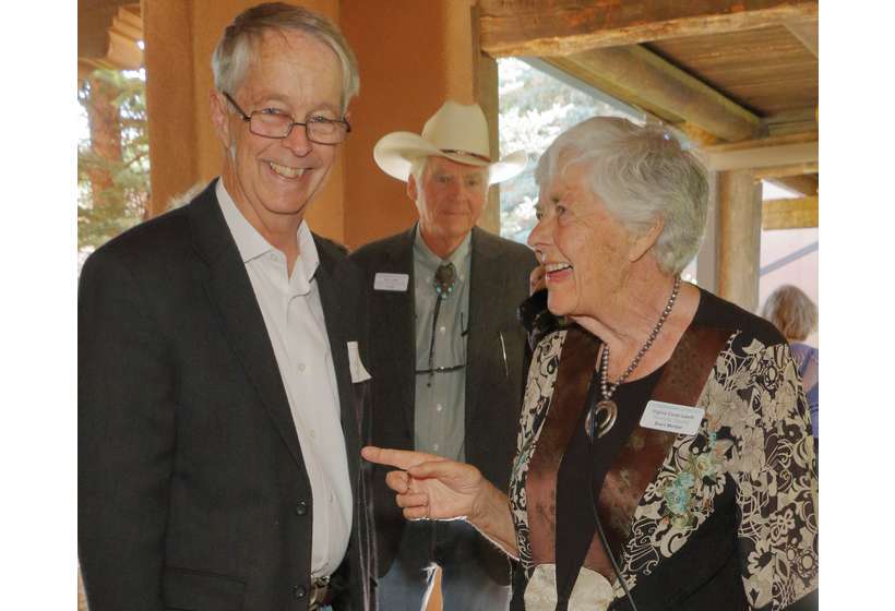 Virginia Couse Leavitt shares a laugh with auction item donor Mark Bahti.