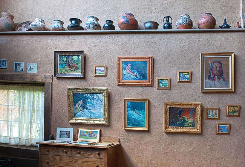East wall of Couse’s studio showing his paintings and Native American pottery.
