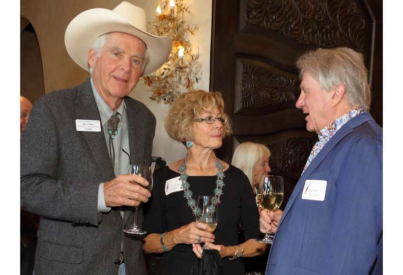 Couse Foundation Founder Al Olson and his wife, Carol Ann, chat with Thomas Minckler, author of "In Poetic Silence: The Floral Paintings of Joseph Henry Sharp."